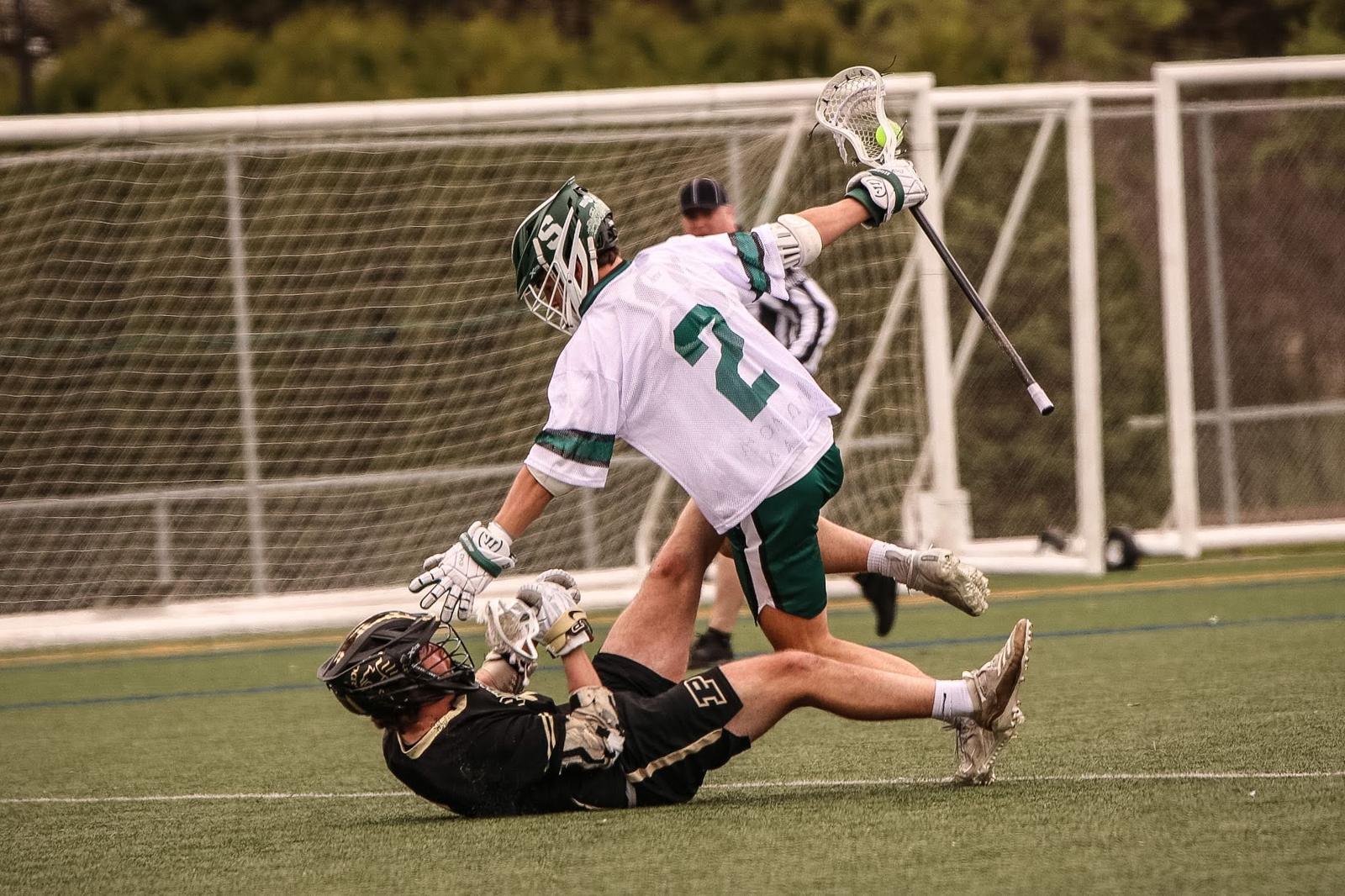 MSU midfielder splitting a defender in front of the goal
